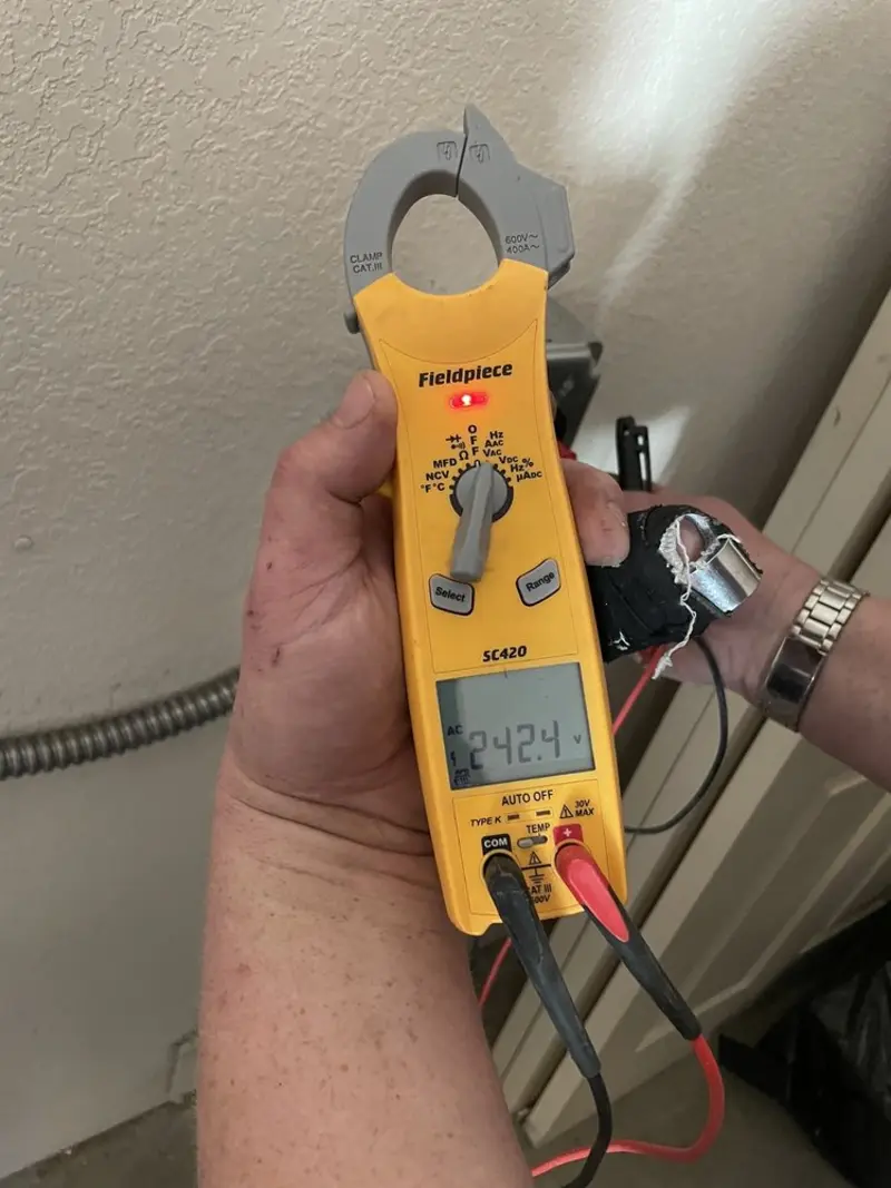 Voltage testing with clamp meter during Recessed Lighting Installation in East Flat Rock